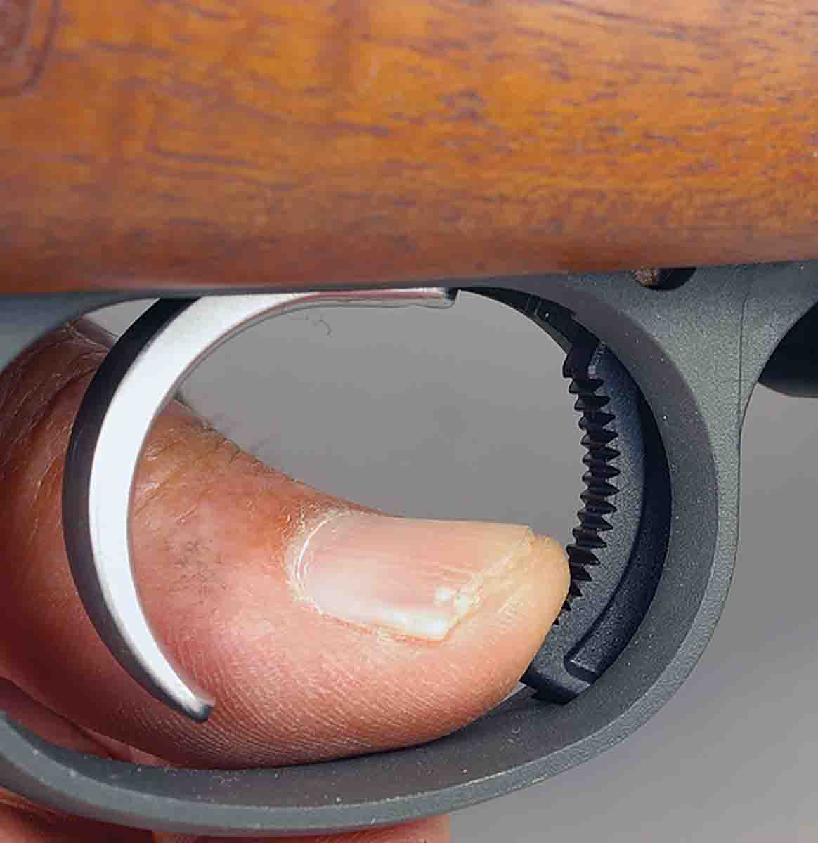 The 557’s magazine release lever is located inside the trigger bow.
